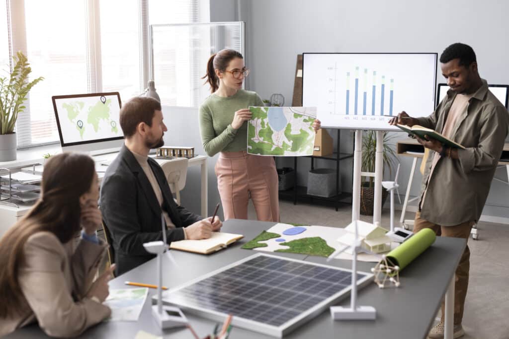 Profissionais discutem estratégias de sustentabilidade empresarial em uma reunião